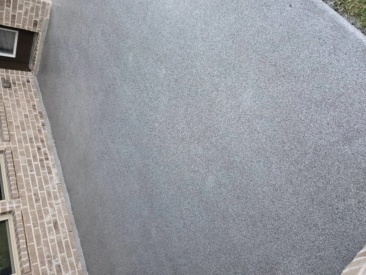 Durable gray flake epoxy coated concrete slab with textured finish for Fort Worth garage