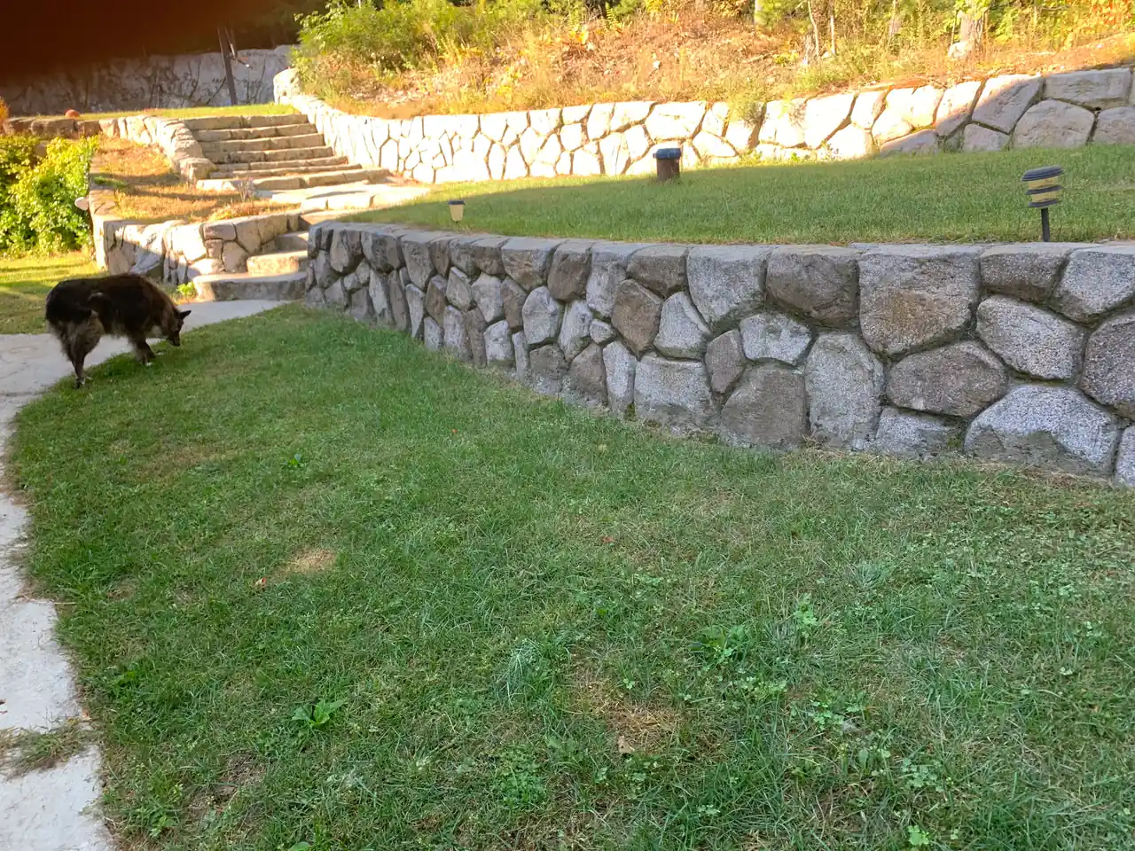 Concrete retaining wall with hand-carved stone texture in Southlake Texas